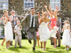 Guests Throwing Confetti Over Bride And Groom